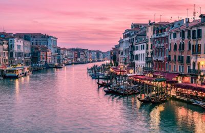 Amazing sunset over Grand Canal from Rialto Bridge in Venice, Italy