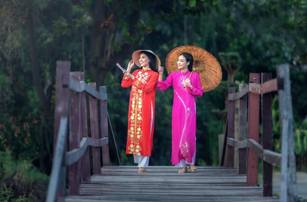 Portrait of Vietnamese girl traditional dress Ao dai is famous traditional costume for woman in Vietnam